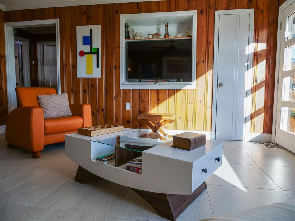 1711 County Road 13 South Elkton, FL 32033 - Photo 49 of 78 a living room with furniture and a flat screen tv