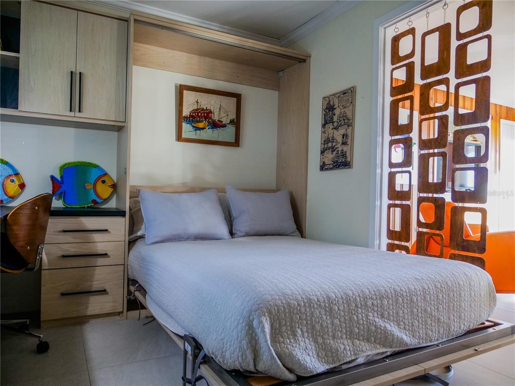 1711 County Road 13 South Elkton, FL 32033 - Photo 56 of 78 a bedroom with a bed and dresser