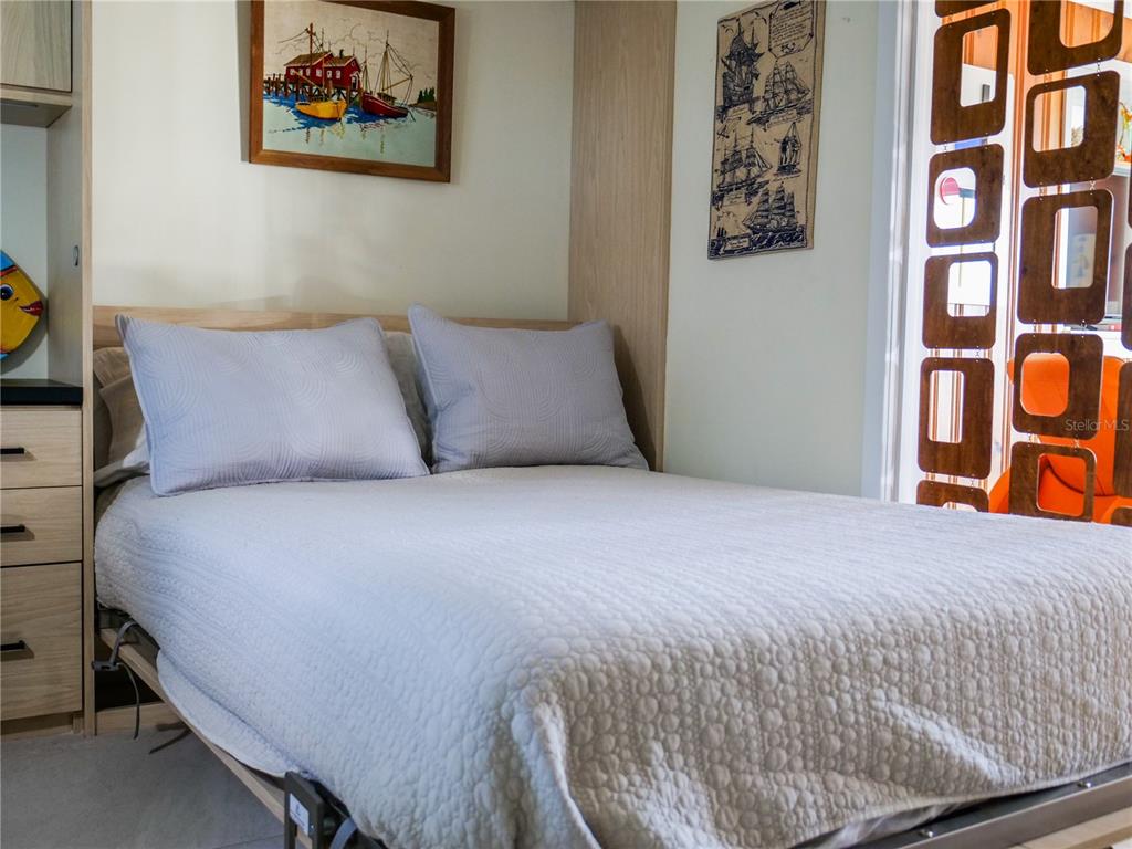 1711 County Road 13 South Elkton, FL 32033 - Photo 57 of 78 a bedroom with a bed and painting on the wall