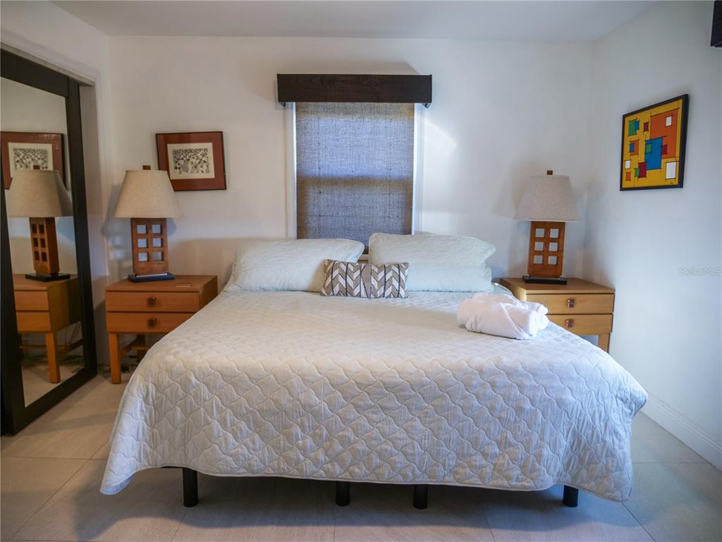 1711 County Road 13 South Elkton, FL 32033 - Photo 69 of 78 a bedroom with a bed and painting on the wall