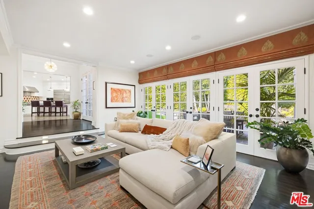 a bathroom with a double vanity sink a mirror and a shower