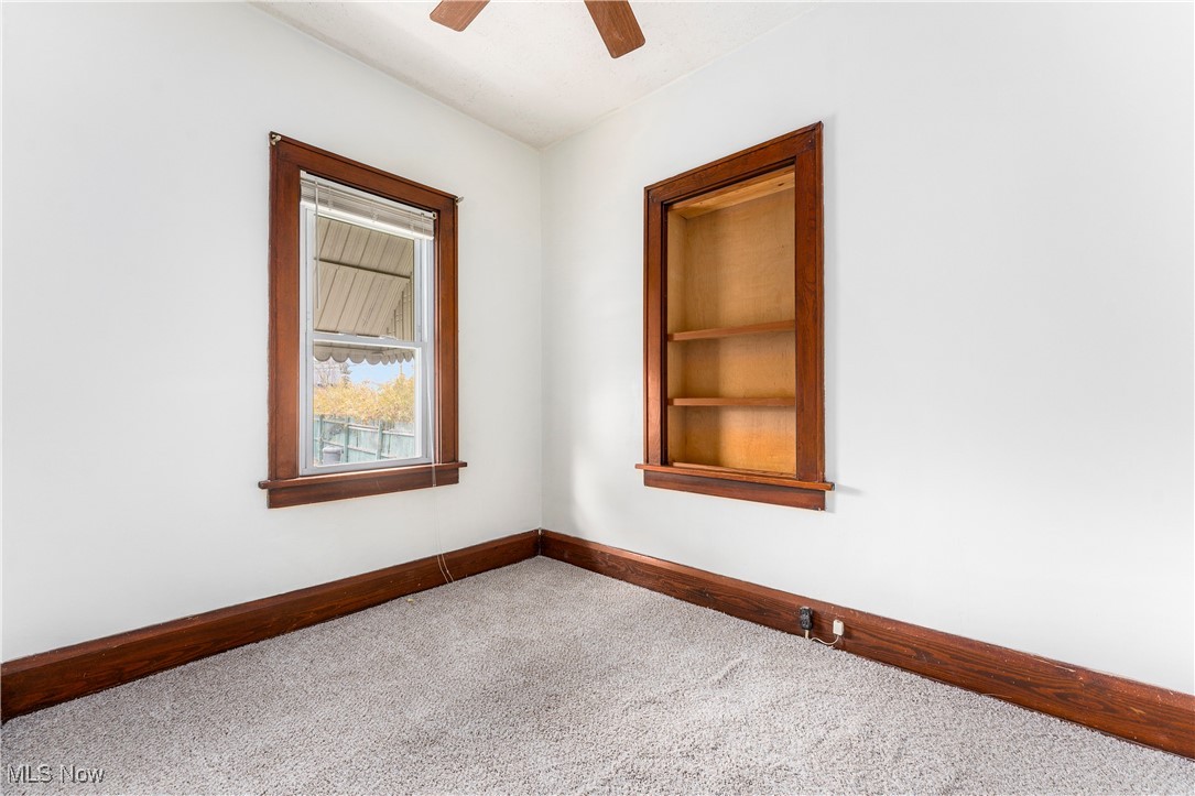 1507 Cherry Road Northwest Massillon, OH 44647 - Photo 15 of 28 Carpeted spare room featuring ceiling fan