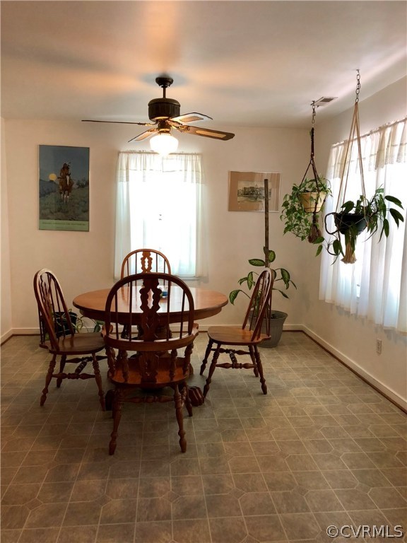 10612 Tokay Road Chesterfield, VA 23832 - Photo 8 of 18 a view of a dining room with furniture and a chandelier