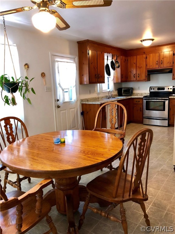 10612 Tokay Road Chesterfield, VA 23832 - Photo 9 of 18 a kitchen with a table chairs sink and microwave