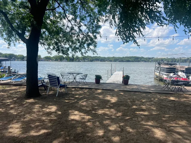a view of a lake with outdoor seating