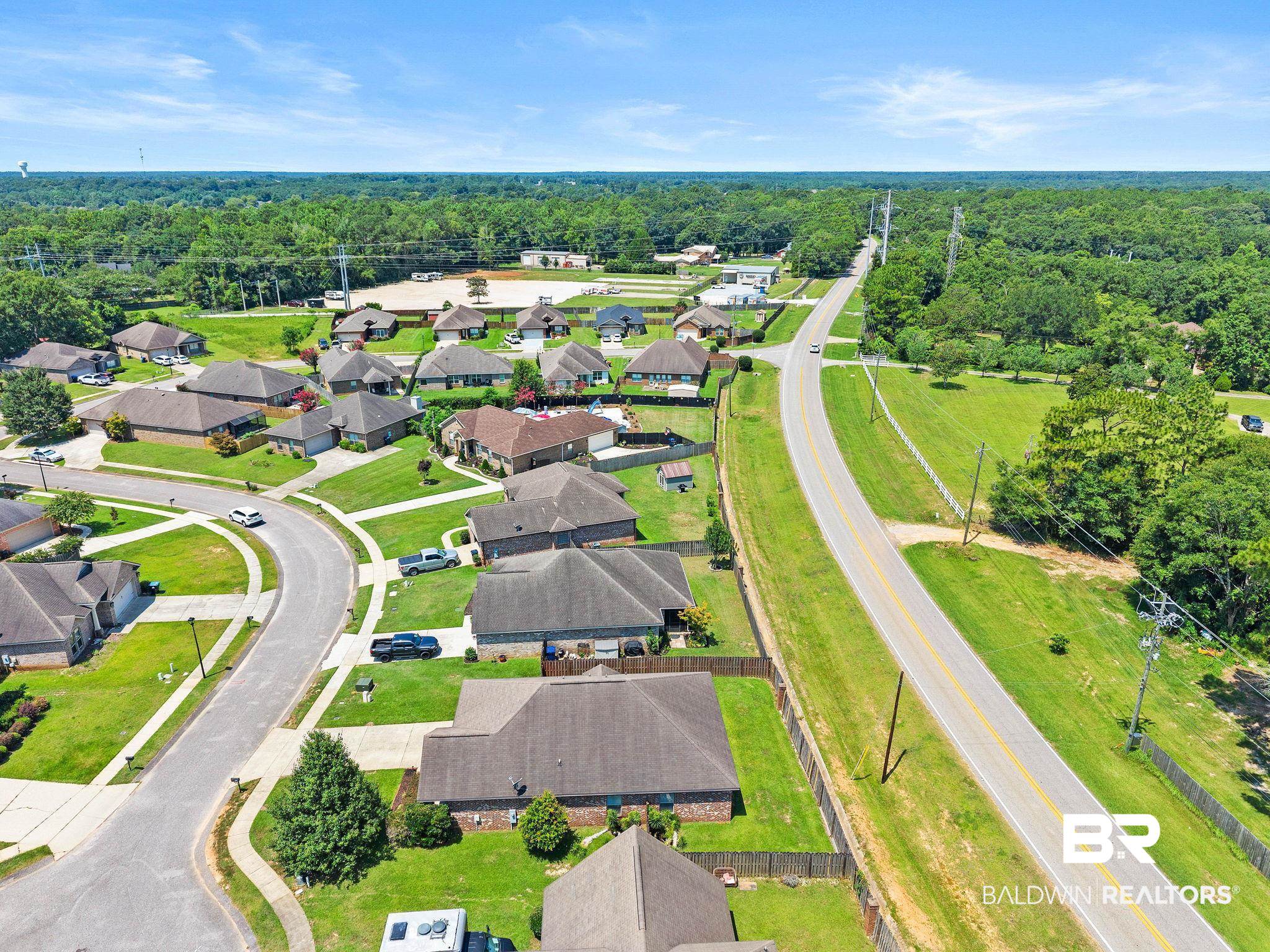 2216 Livingstone Court Mobile, AL 36695 - Photo 52 of 62 Residential neighborhood featuring a curvilinear street layout and individual homes with landscaped lawns