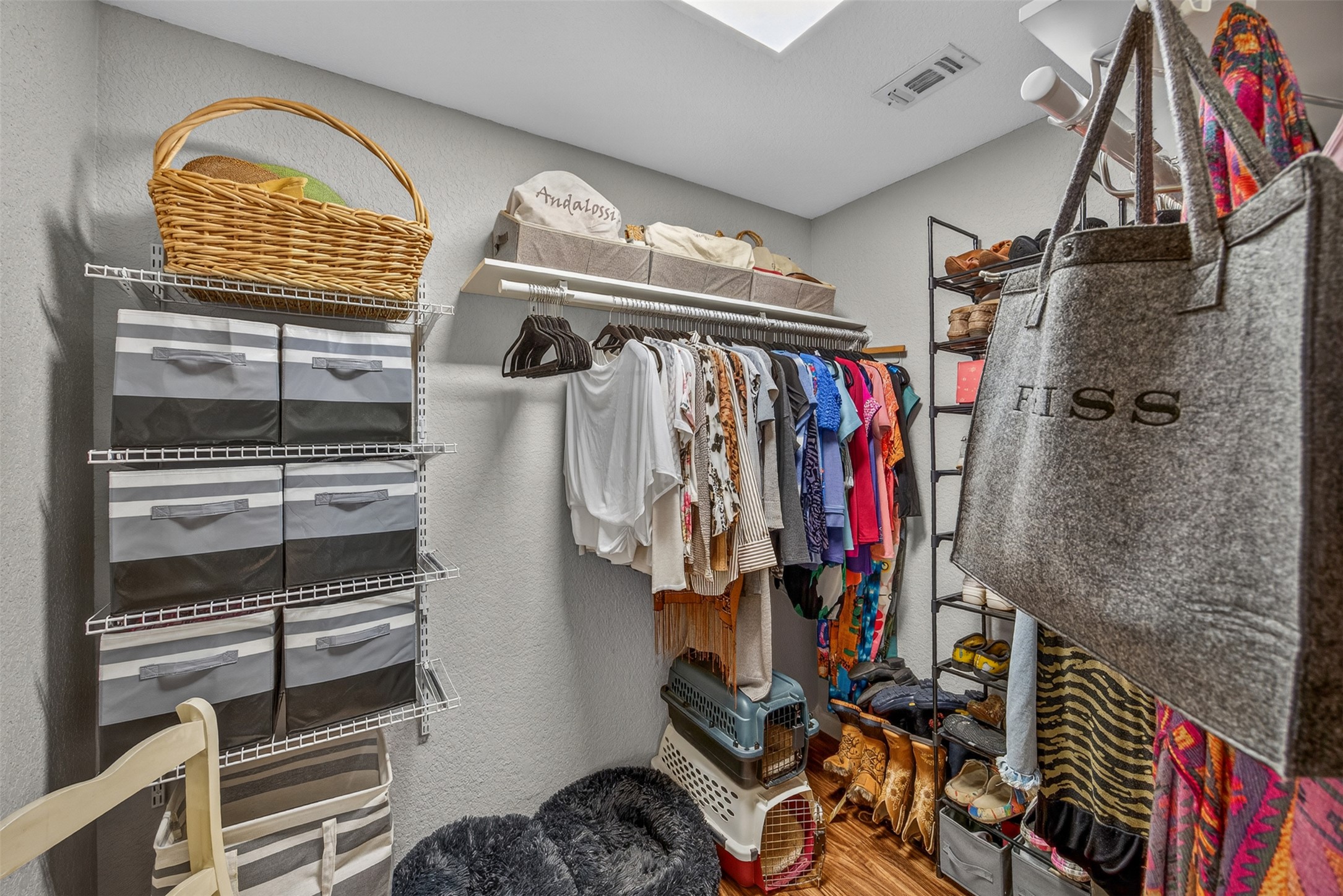 217 Walnut Avenue Luling, TX 78648 - Photo 16 of 38 a view of walk in closet with clothes