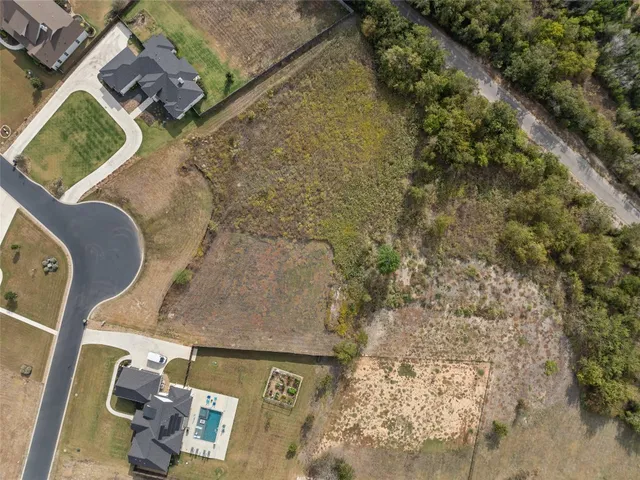 an aerial view of residential house with outdoor space