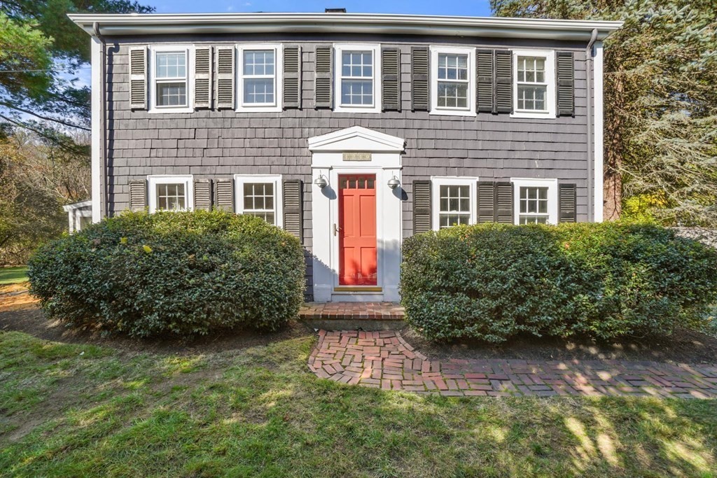 1219 High Street Westwood, MA 02090 - Photo 1 of 30 a front view of a house with garden