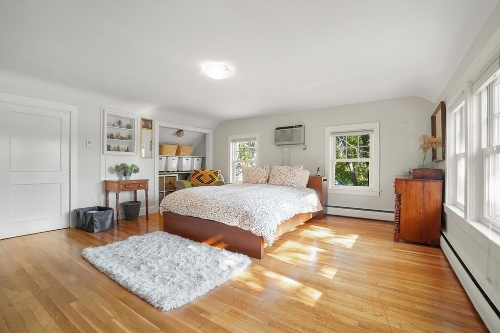 1219 High Street Westwood, MA 02090 - Photo 19 of 30 a spacious bedroom with a bed a dresser and a window