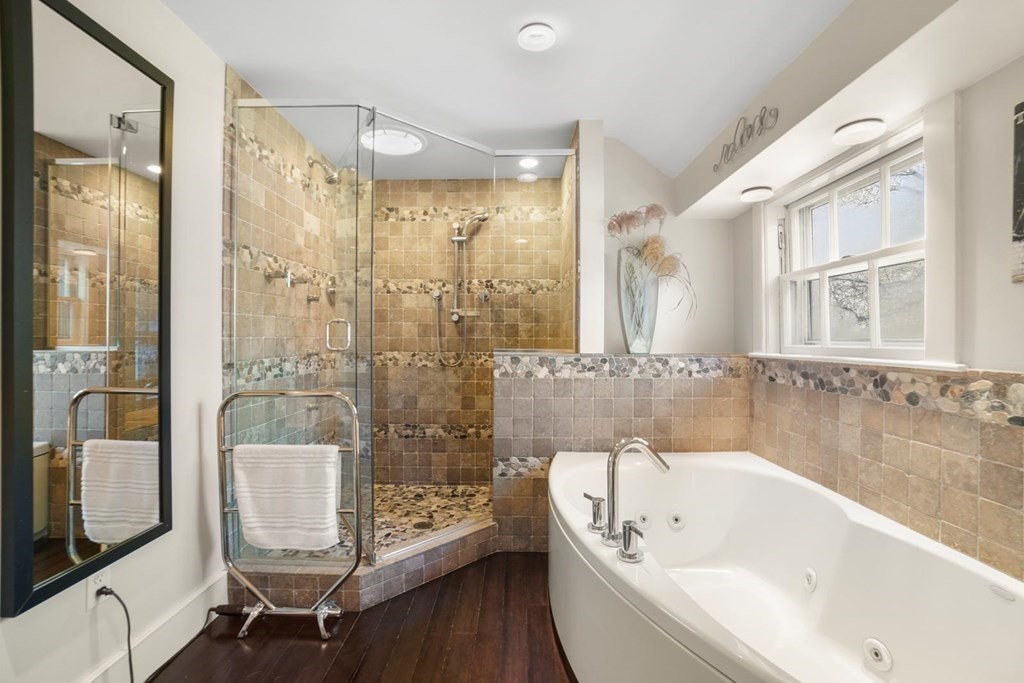 1219 High Street Westwood, MA 02090 - Photo 21 of 30 a bathroom with a bathtub a mirror a sink and shower