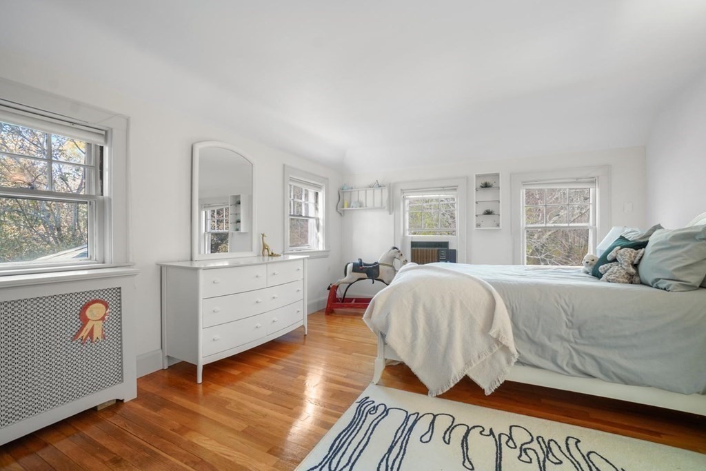 1219 High Street Westwood, MA 02090 - Photo 23 of 30 a spacious bedroom with a bed and a window