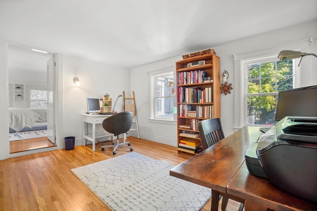 1219 High Street Westwood, MA 02090 - Photo 24 of 30 a living room with furniture and a book shelf