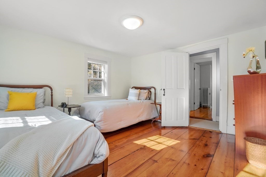 1219 High Street Westwood, MA 02090 - Photo 26 of 30 a bedroom with two beds and a lamp