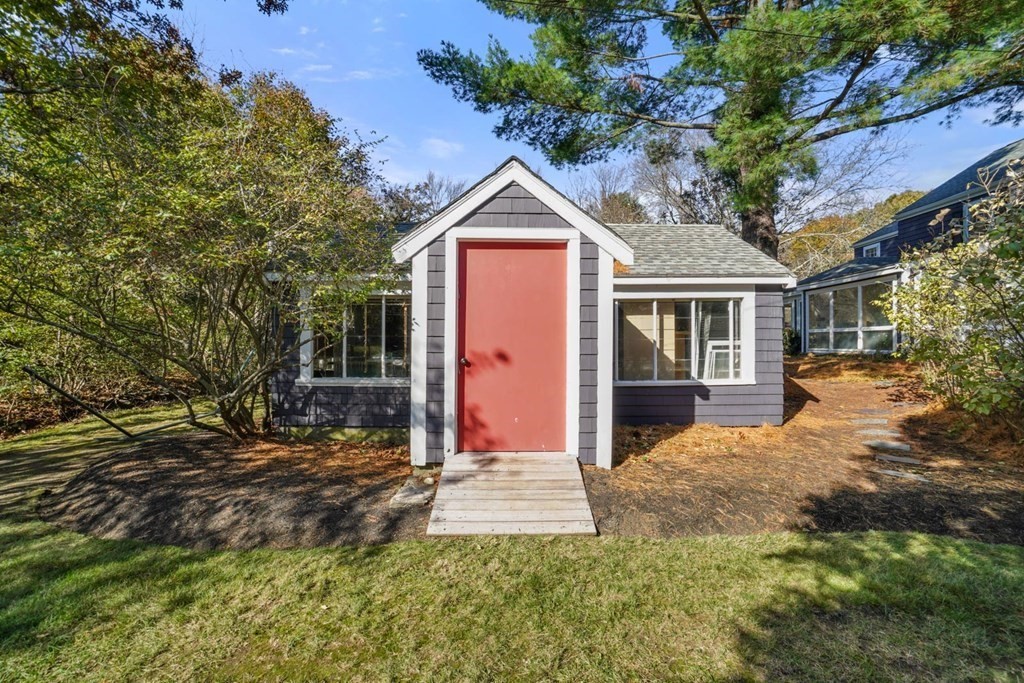 1219 High Street Westwood, MA 02090 - Photo 28 of 30 a front view of a house with a yard and garage