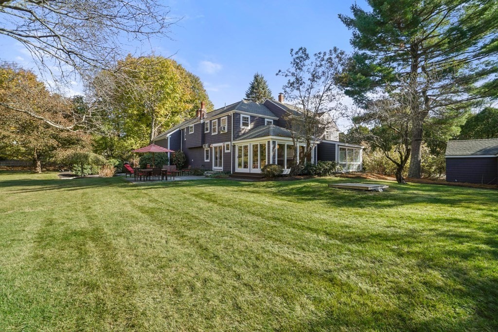 1219 High Street Westwood, MA 02090 - Photo 5 of 30 a front view of a house with a yard