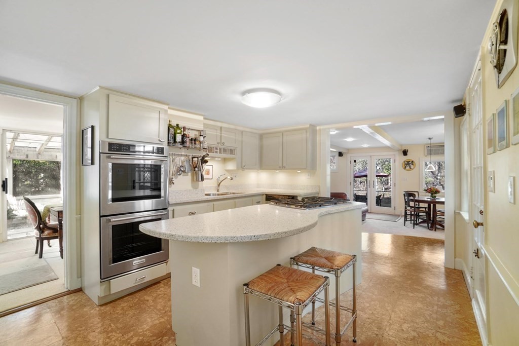 1219 High Street Westwood, MA 02090 - Photo 6 of 30 a kitchen with stainless steel appliances granite countertop a stove and a refrigerator