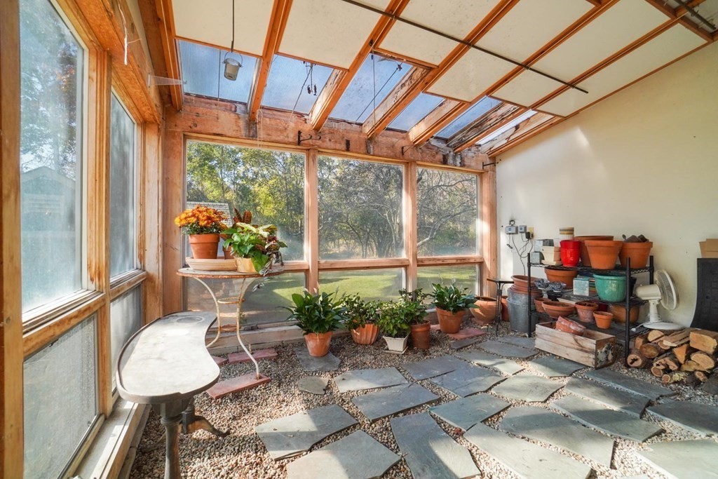 1219 High Street Westwood, MA 02090 - Photo 9 of 30 a room with furniture and a potted plant