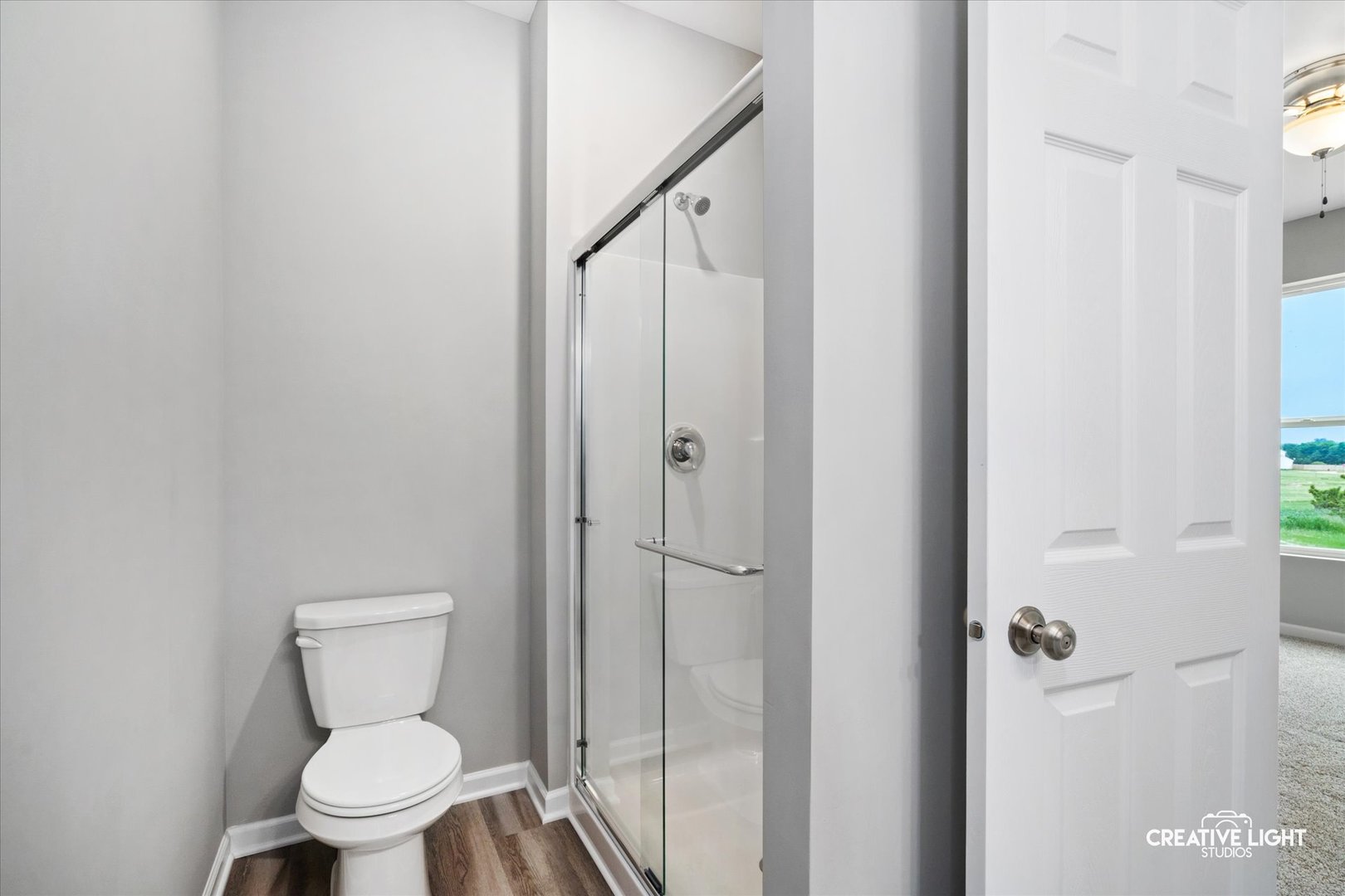 526 Hahn Drive Cortland, IL 60112 - Photo 12 of 20 a bathroom with a toilet and a shower