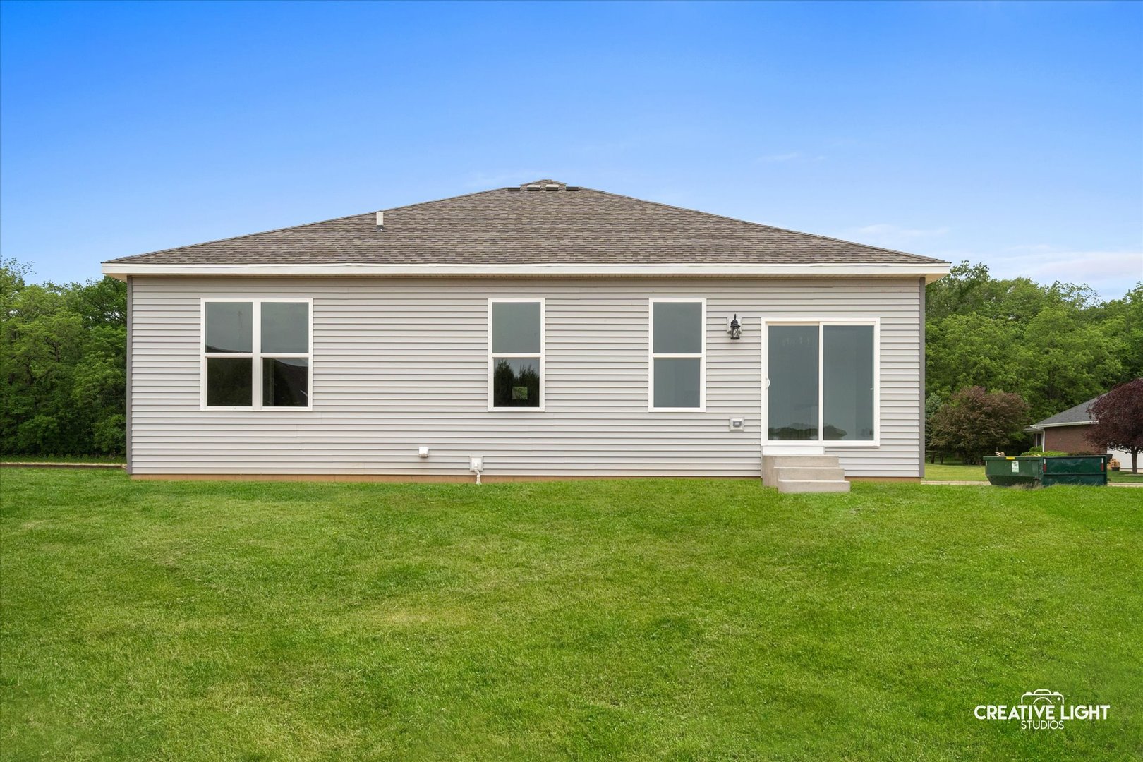 526 Hahn Drive Cortland, IL 60112 - Photo 18 of 20 a front view of a house with a yard