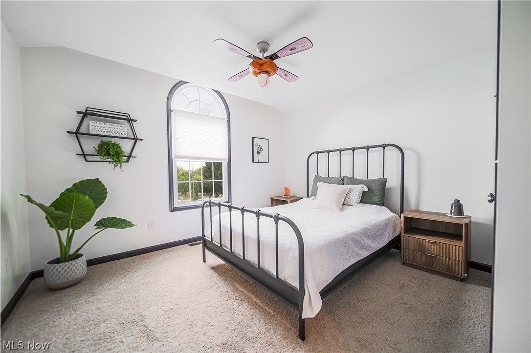 9554 Dover Road Apple Creek, OH 44606 - Photo 25 of 45 Carpeted bedroom with ceiling fan and baseboards