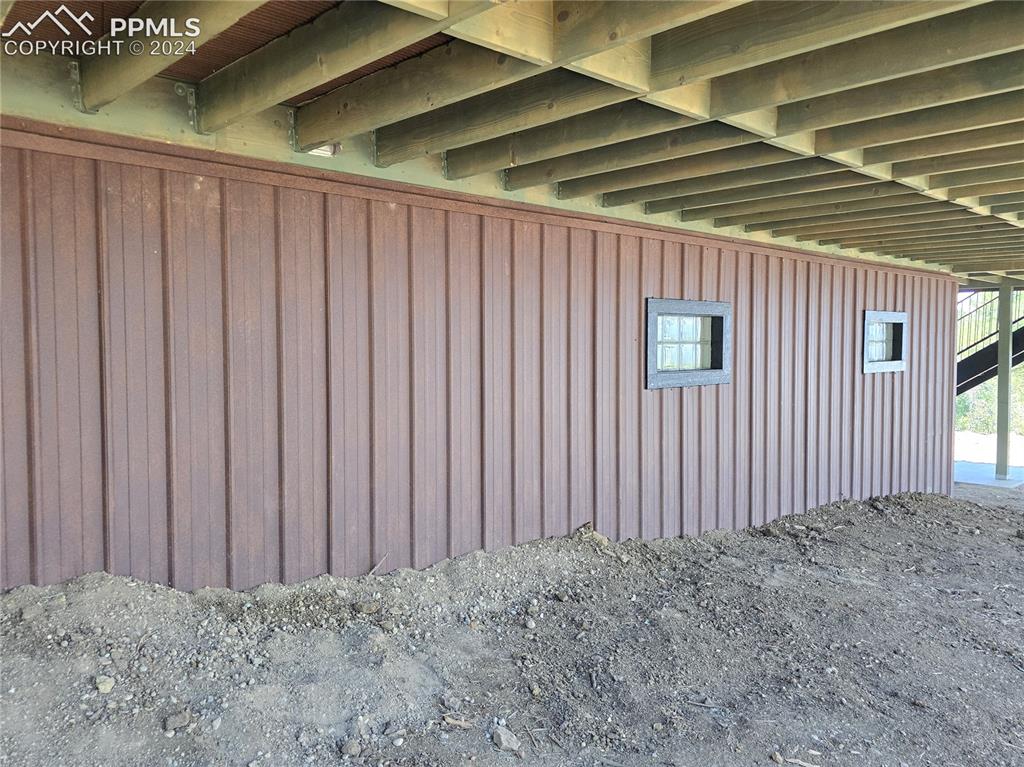 33036 Meadow Ridge Lane Trinidad, CO 81082 - Photo 11 of 50 View of home's exterior with rusted steel siding over ICF foundation