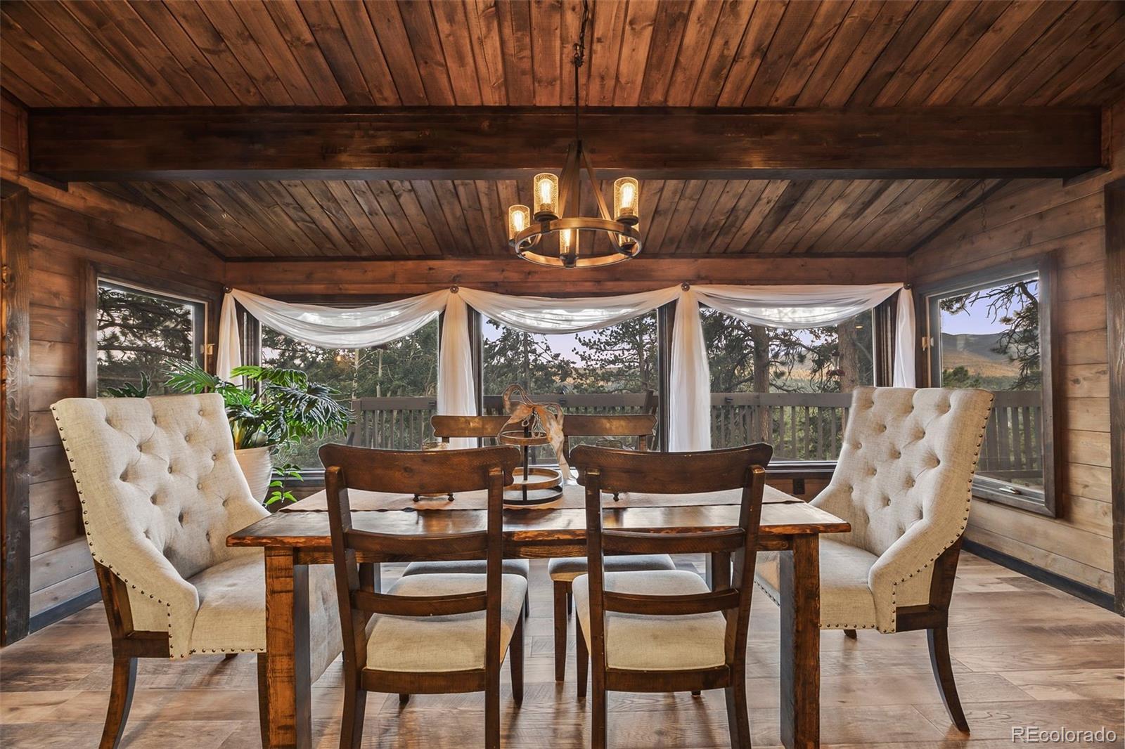 193 Mary Beth Road Evergreen, CO 80439 - Photo 12 of 46 a dining room with furniture and window