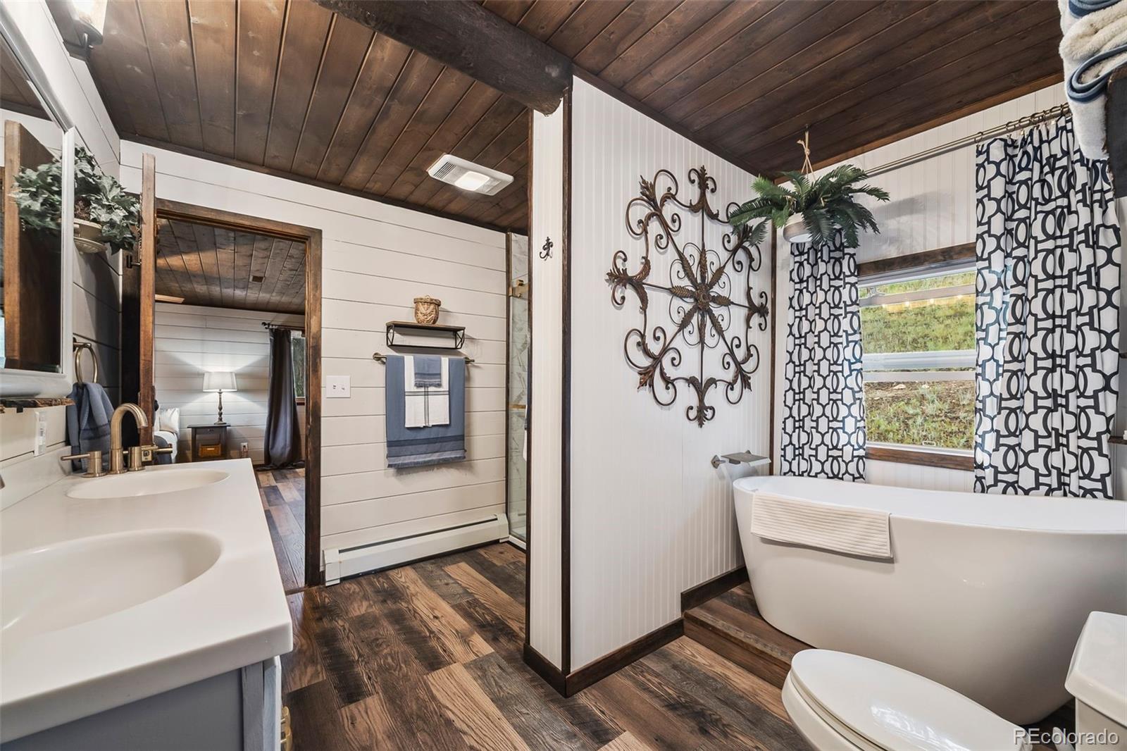 193 Mary Beth Road Evergreen, CO 80439 - Photo 20 of 46 a bathroom with a sink toilet and shower