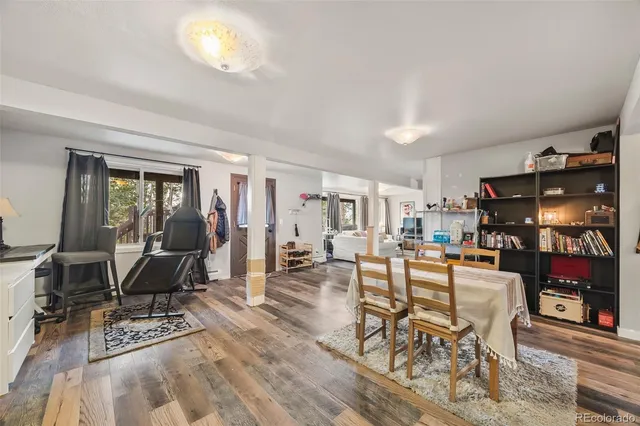 a kitchen with a refrigerator and a sink