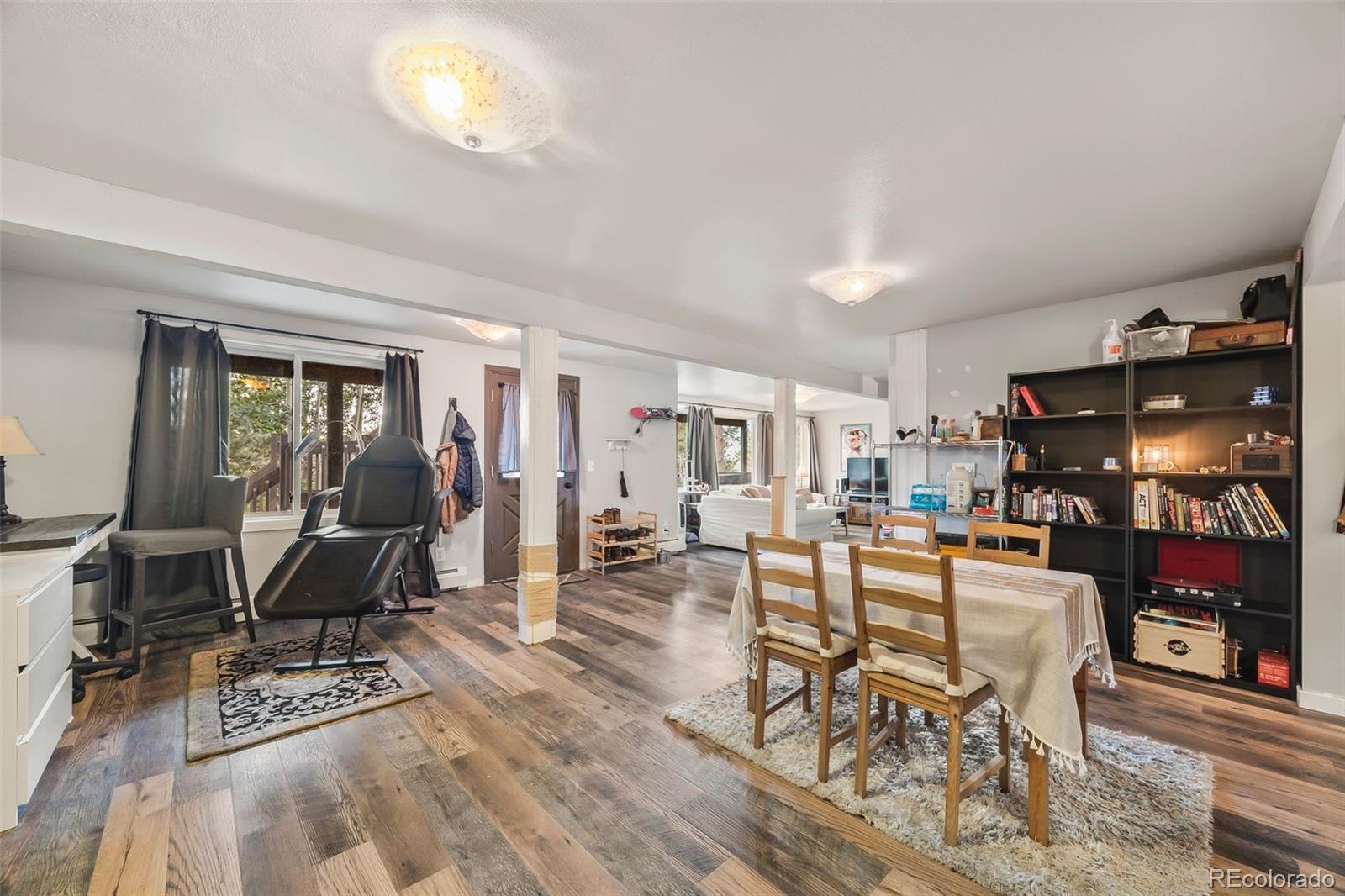 193 Mary Beth Road Evergreen, CO 80439 - Photo 30 of 46 a living room with furniture a table and chairs