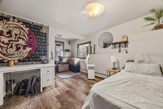 a bedroom with a bed and a book shelf