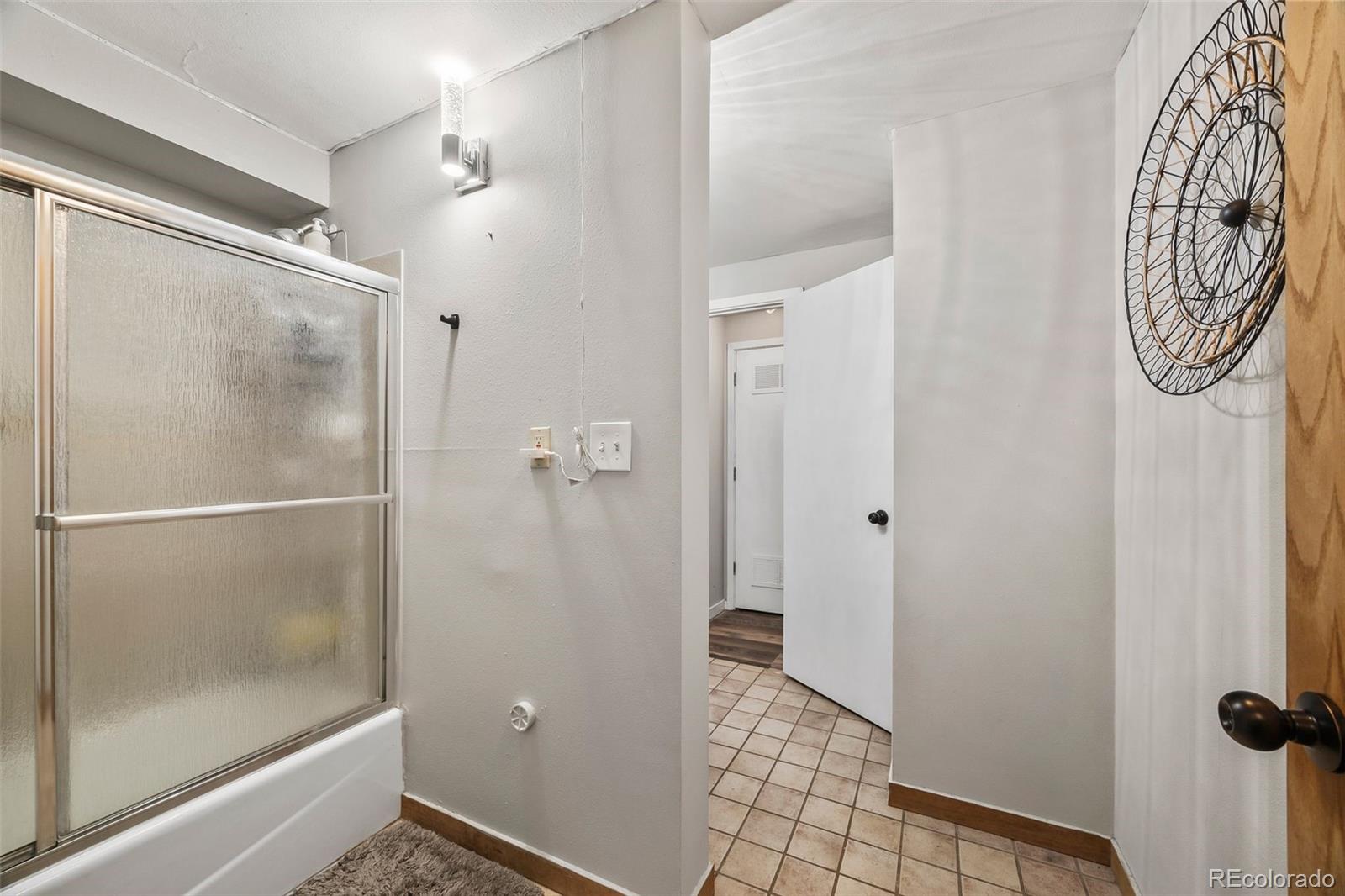 193 Mary Beth Road Evergreen, CO 80439 - Photo 35 of 46 a bathroom with a shower and a mirror