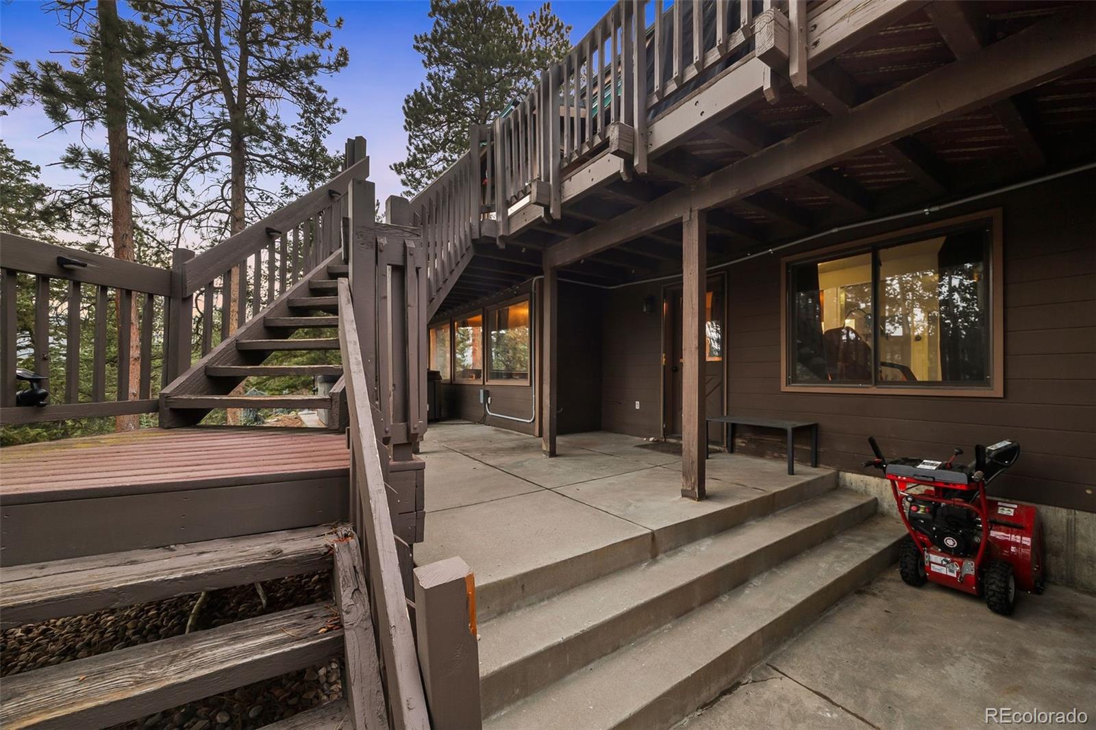 193 Mary Beth Road Evergreen, CO 80439 - Photo 40 of 46 a outdoor space with lots of trees in the background