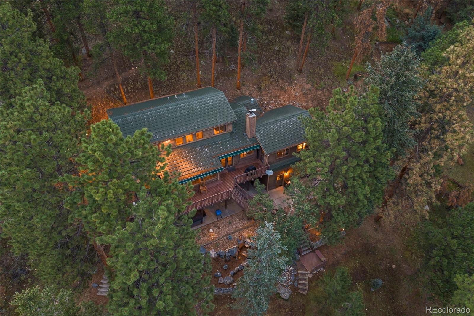 193 Mary Beth Road Evergreen, CO 80439 - Photo 42 of 46 an aerial view of a house with a yard