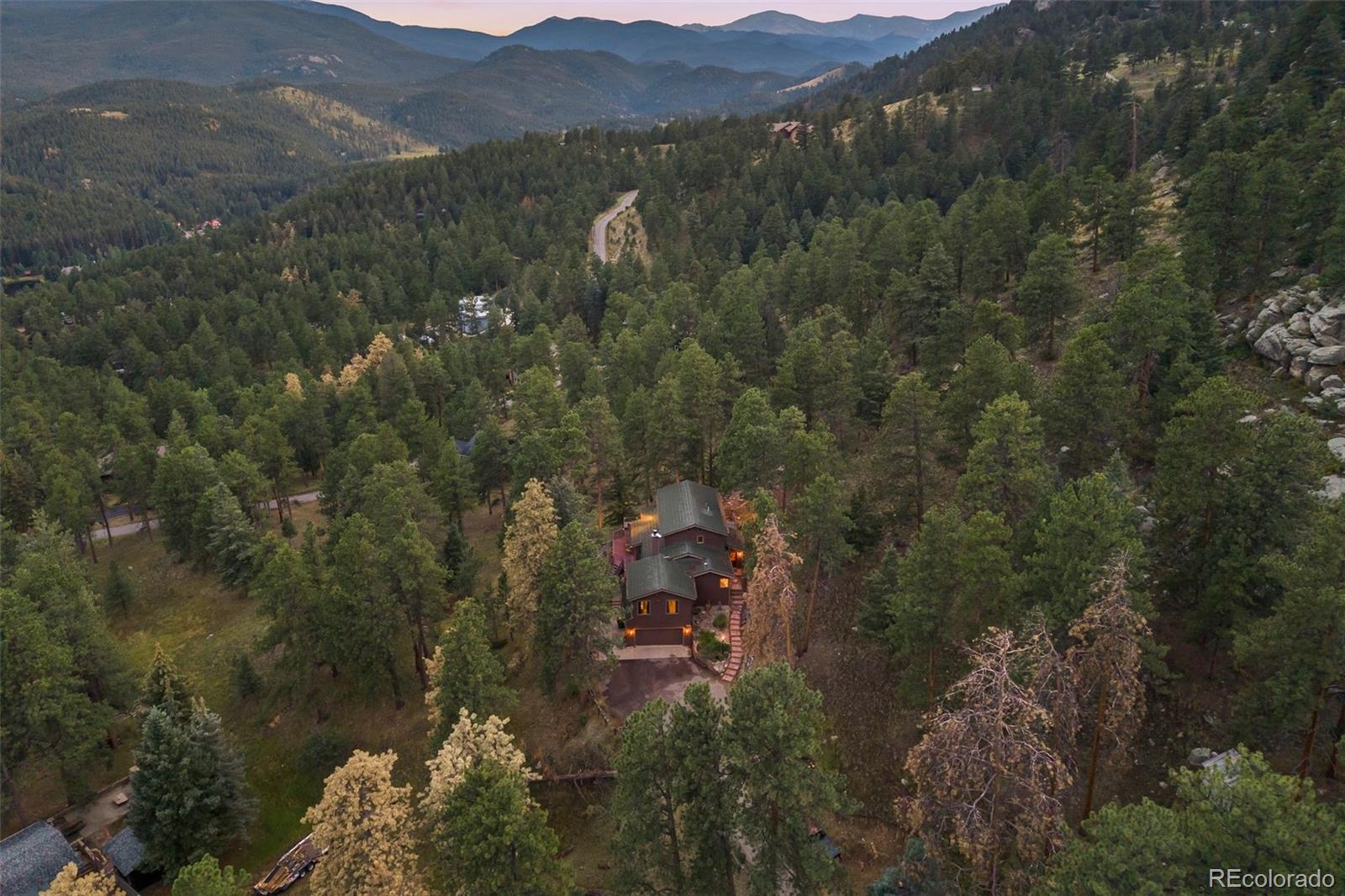 193 Mary Beth Road Evergreen, CO 80439 - Photo 46 of 46 a view of a forest with a street