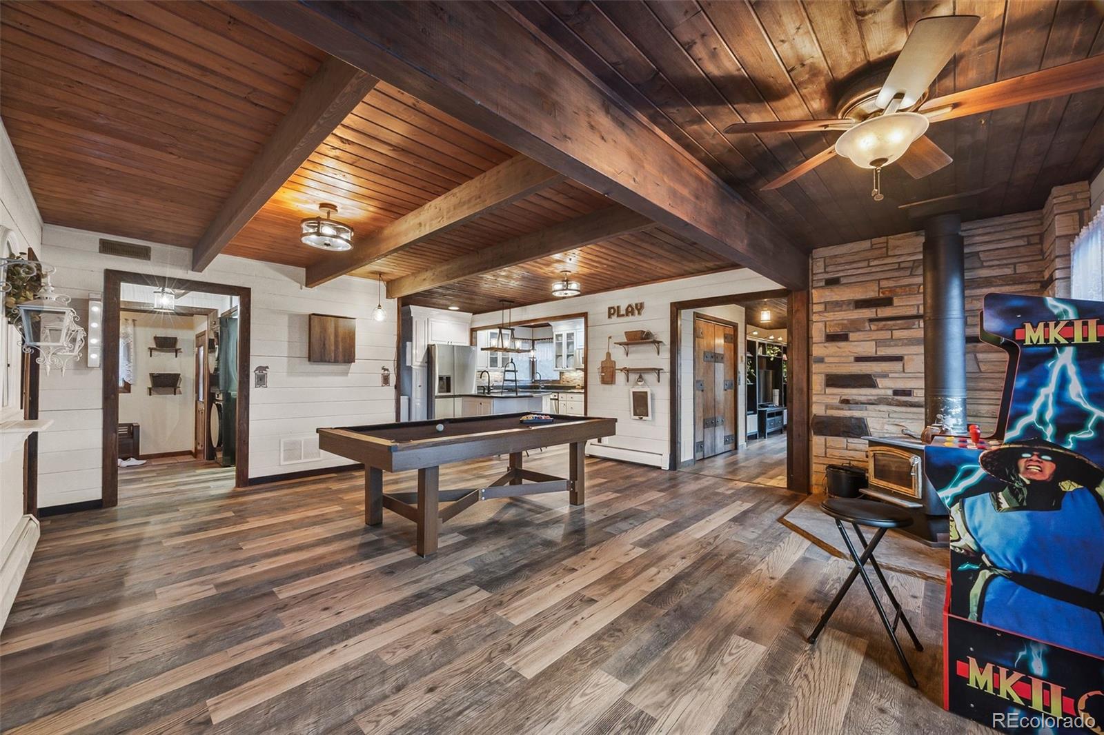 193 Mary Beth Road Evergreen, CO 80439 - Photo 5 of 46 a reading room with furniture and a wooden floors