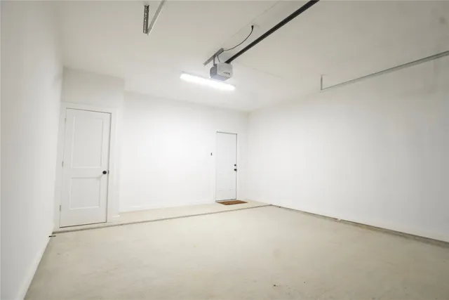 an empty room with a empty space and windows