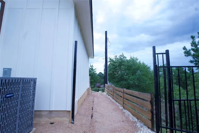a view of a balcony with wooden fence