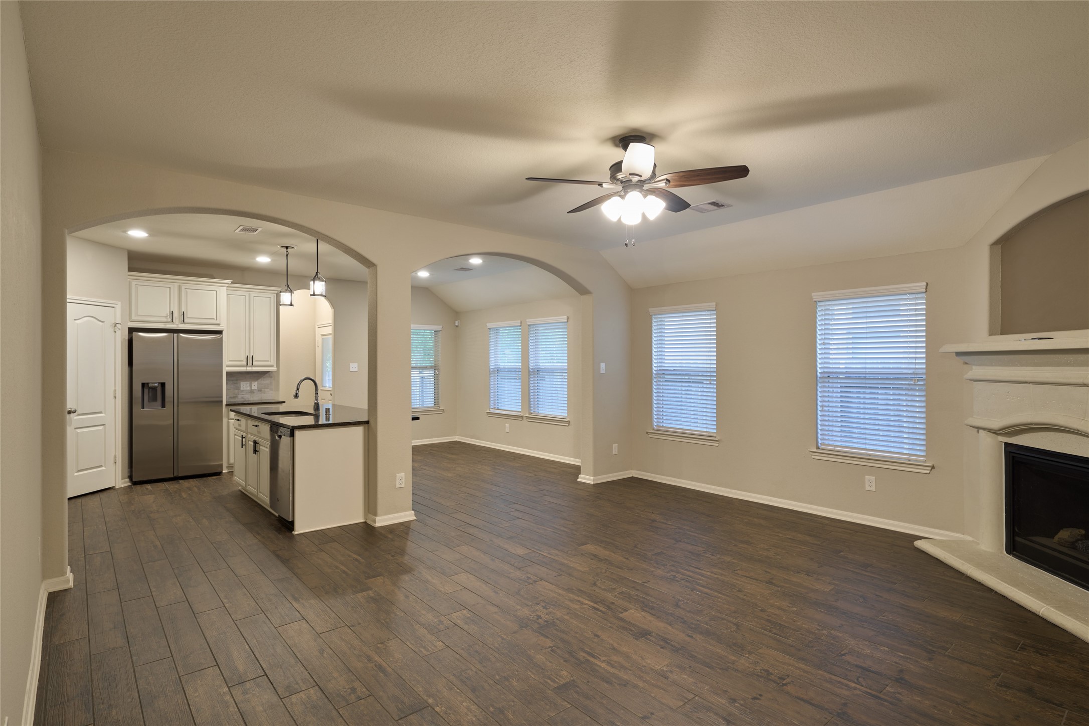 116 Fox Trail Road Montgomery, TX 77316 - Photo 12 of 50 Open living area features a modern kitchen with stainless steel appliances and an spacious island.