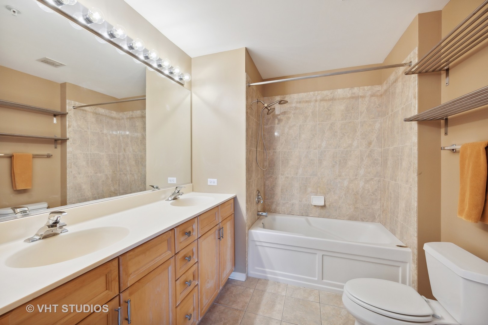 1640 Maple Avenue, Unit 401 Evanston, IL 60201 - Photo 12 of 21 a bathroom with a granite countertop sink a toilet and shower