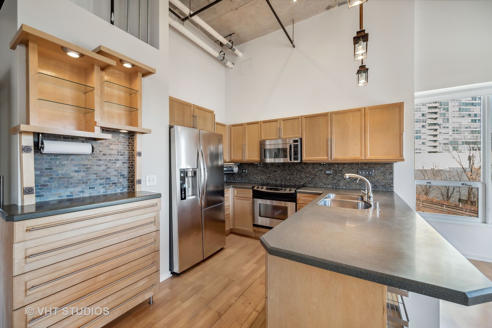 1640 Maple Avenue, Unit 401 Evanston, IL 60201 - Photo 5 of 21 a kitchen with stainless steel appliances a sink a stove and a refrigerator