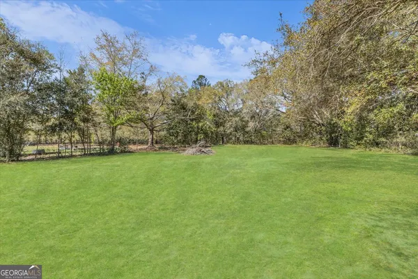 a view of outdoor space with trees all around