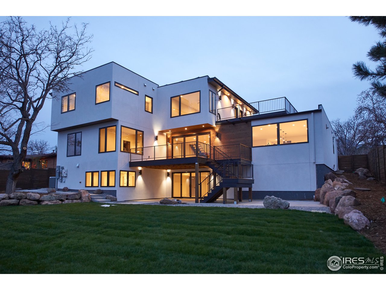 3155 Stanford Avenue Boulder, CO 80305 - Photo 3 of 8 a front view of a house with a garden
