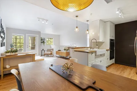 a view of a livingroom with workspace and a couch