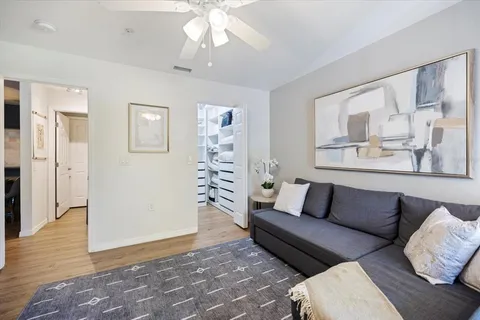 a view of a lake with houses in back