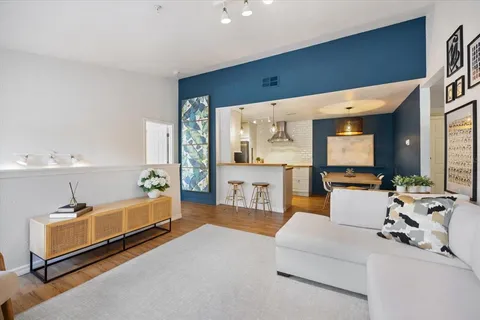 a view of kitchen island with granite countertop furniture and a sink