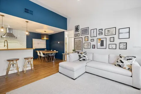a large kitchen with a large counter top appliances and cabinets