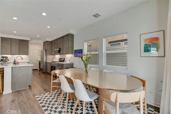 a close up of a white vase with flowers