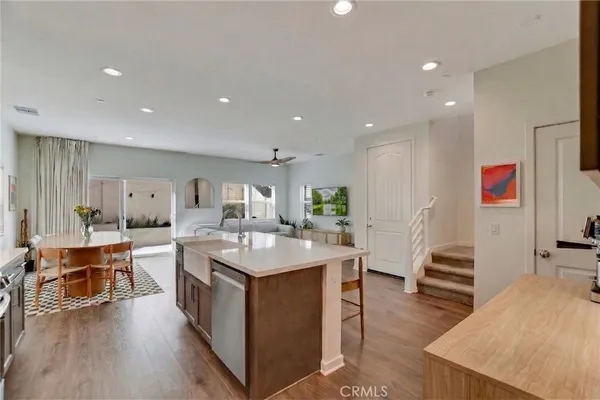 a kitchen with a sink stove and refrigerator