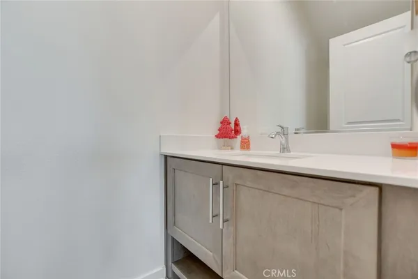a bathroom with a sink and a window